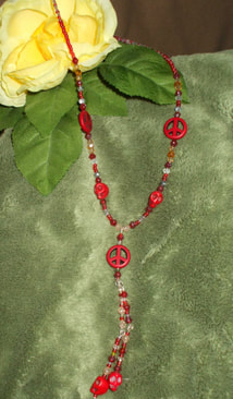 handcrafted red howlite skull and peace sign necklace peace and quiet picture